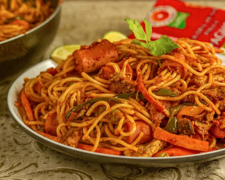 Closeup of a spicy spaghetti dish with assorted vegetables and meat, perfect for a tasty meal.