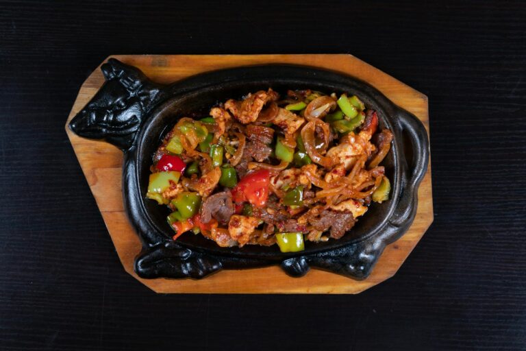 Flavorful beef and vegetable stir-fry served hot on a unique cast iron skillet, perfect for dinner.